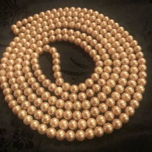 Long and slinky single strand of faux pearls